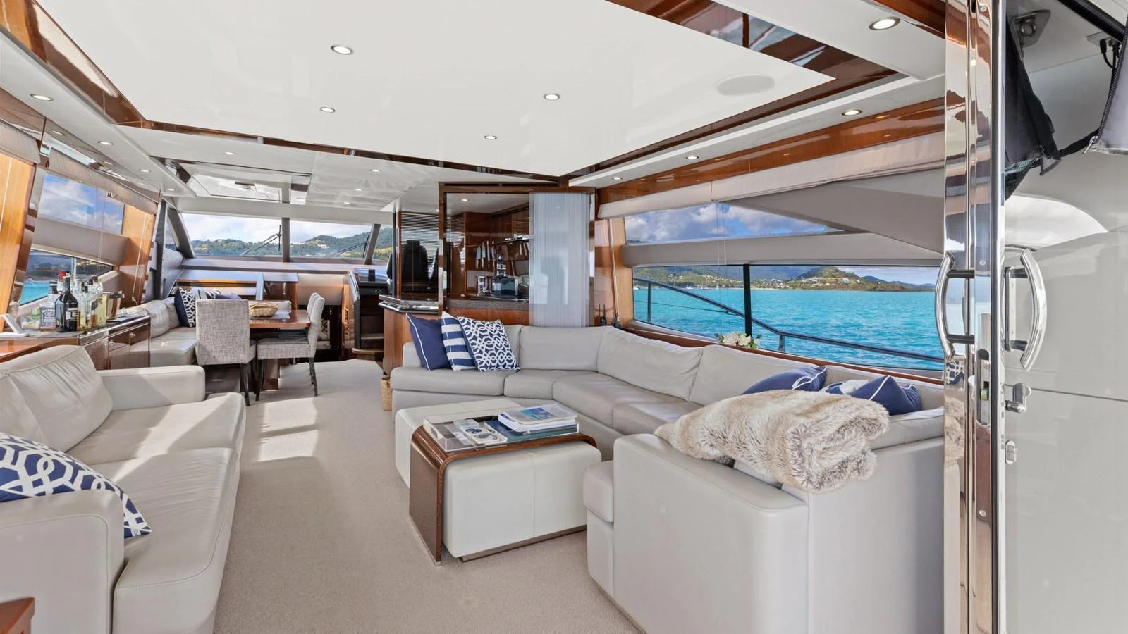 The salon offers a spacious and luxurious seating area with panoramic views of the sea. aboard ABOUT TIME Yacht for Sale