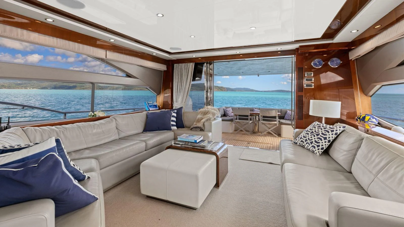 The salon offers a spacious and luxurious seating area with panoramic views of the sea. aboard ABOUT TIME Yacht for Sale