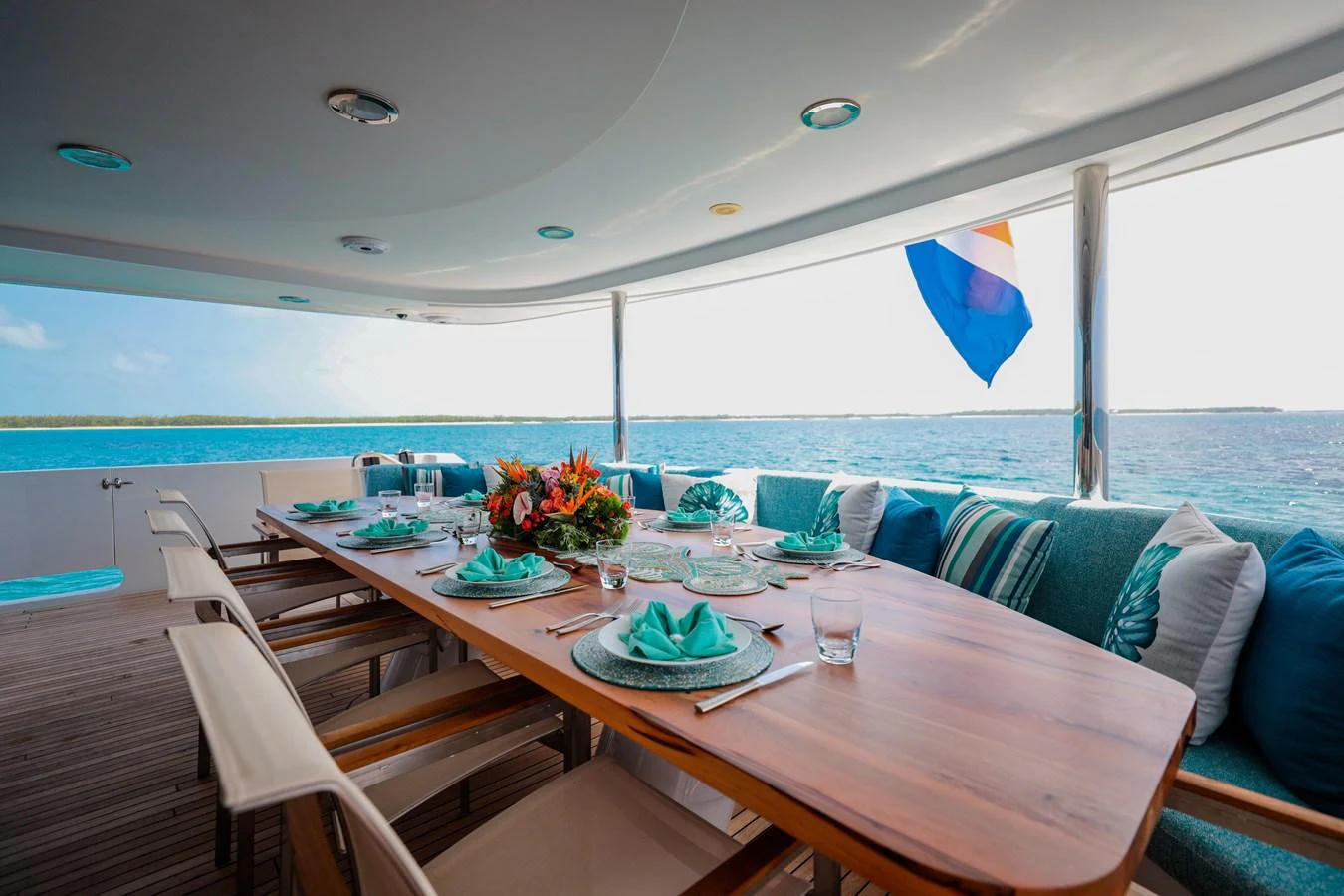 a table set for a meal on a boat aboard CUPCAKE Yacht for Sale