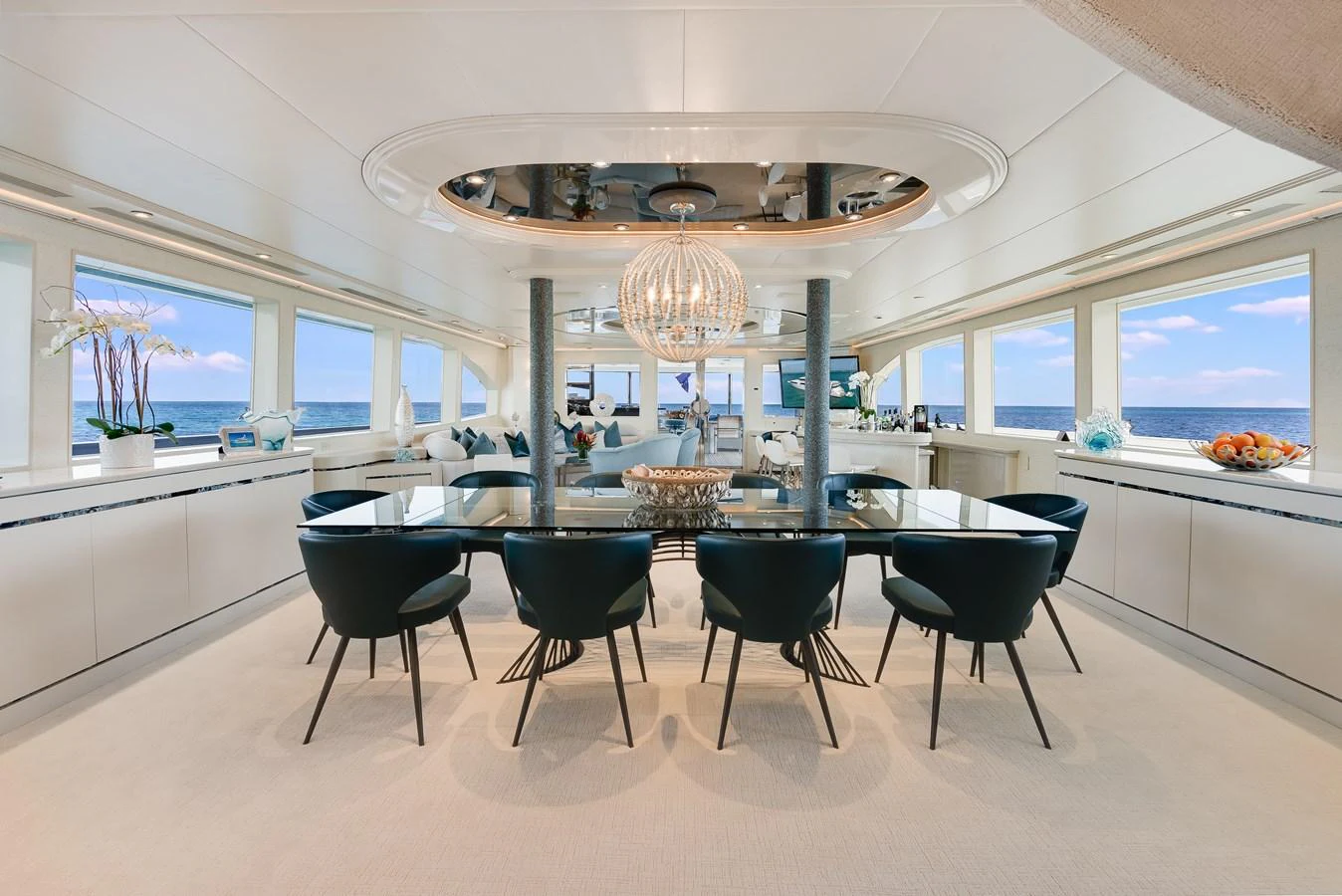 a large dining room with a table and chairs aboard CUPCAKE Yacht for Sale