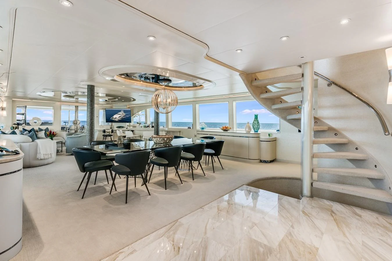 a large room with tables and chairs aboard CUPCAKE Yacht for Sale
