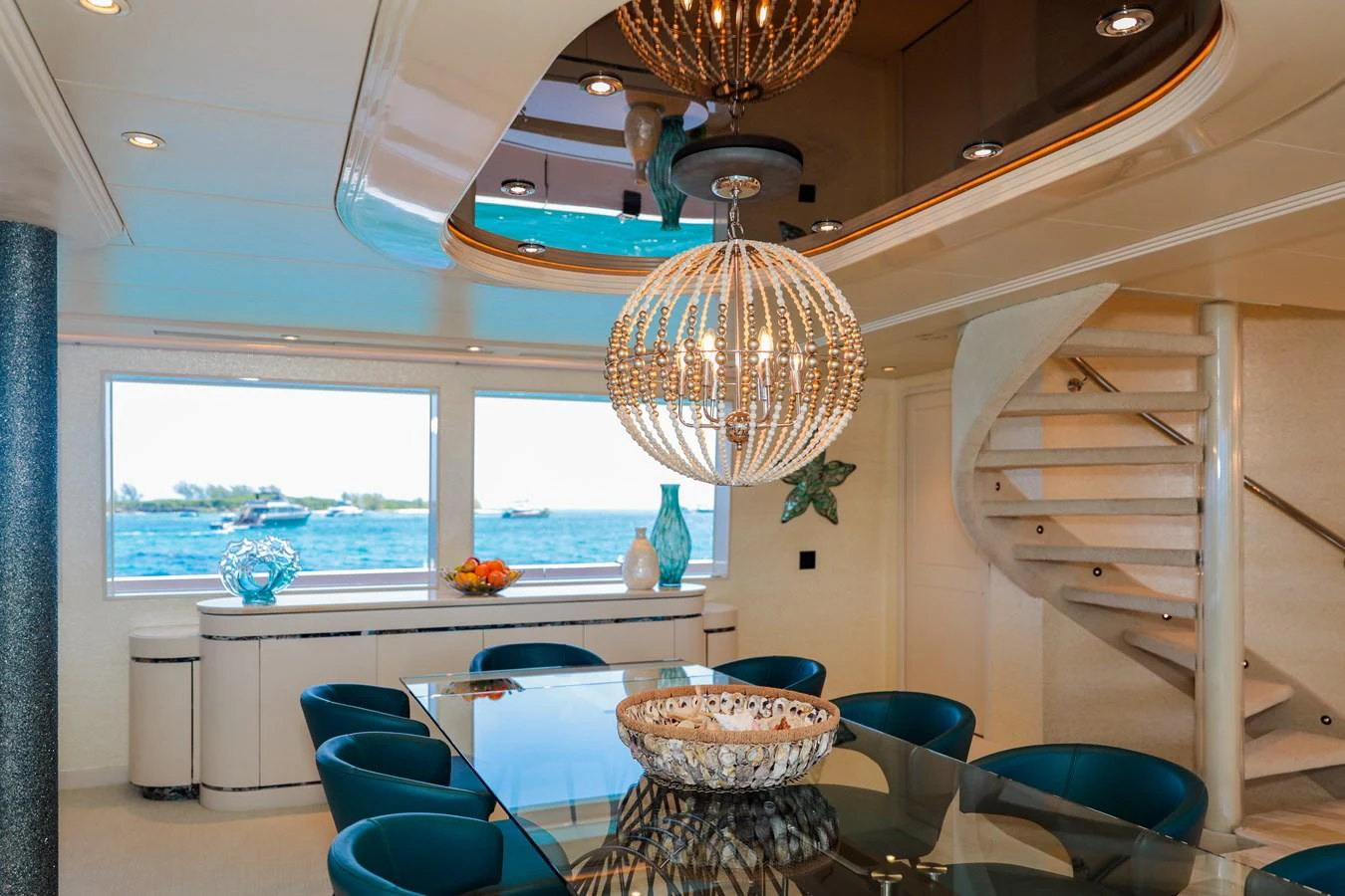 a room with a table and chairs aboard CUPCAKE Yacht for Sale
