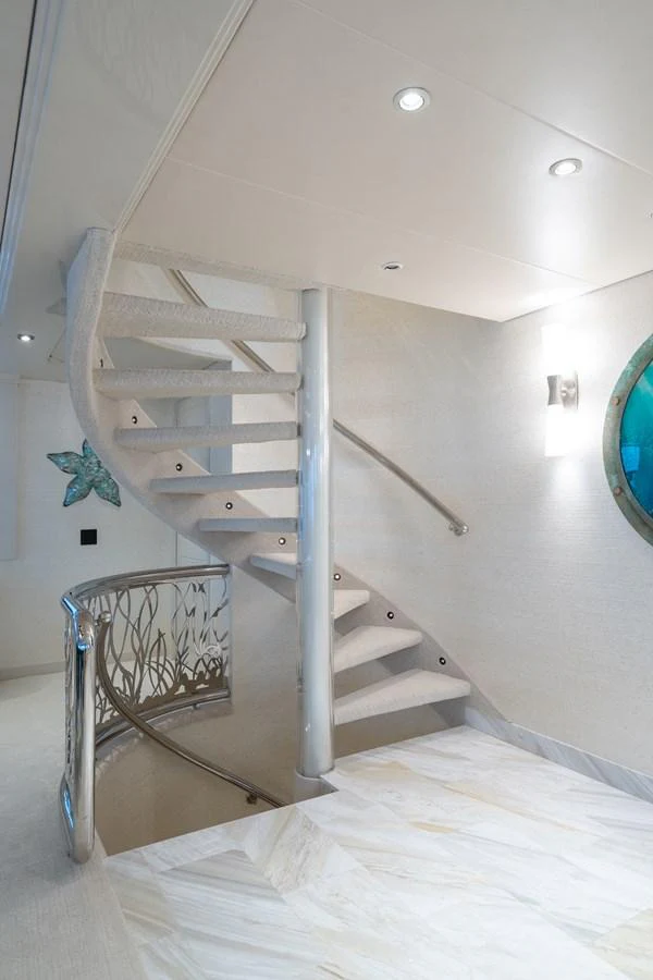 a staircase with a railing aboard CUPCAKE Yacht for Sale