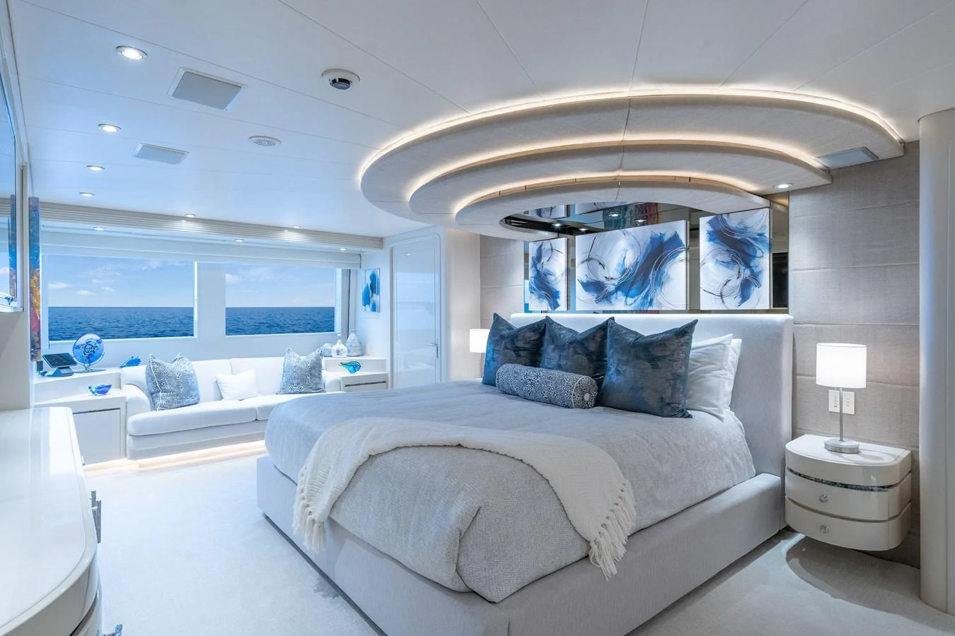 a room with a bed and a large window aboard CUPCAKE Yacht for Sale