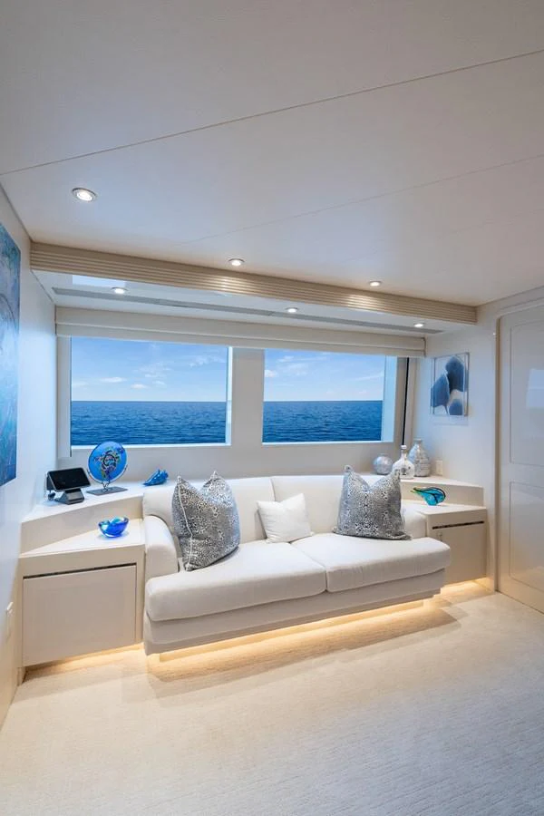 a white couch in a room aboard CUPCAKE Yacht for Sale