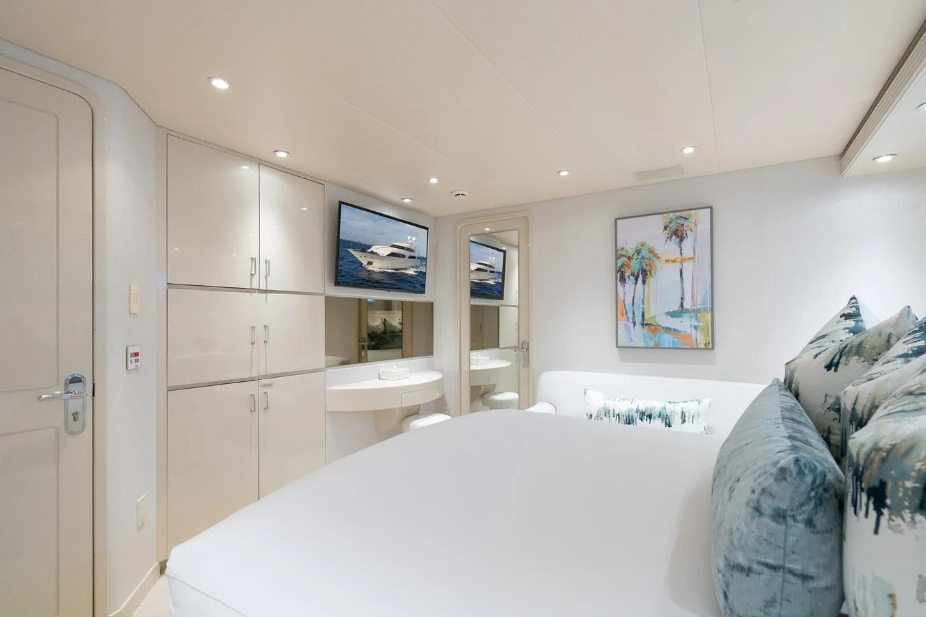 a bedroom with a bed and a television aboard CUPCAKE Yacht for Sale