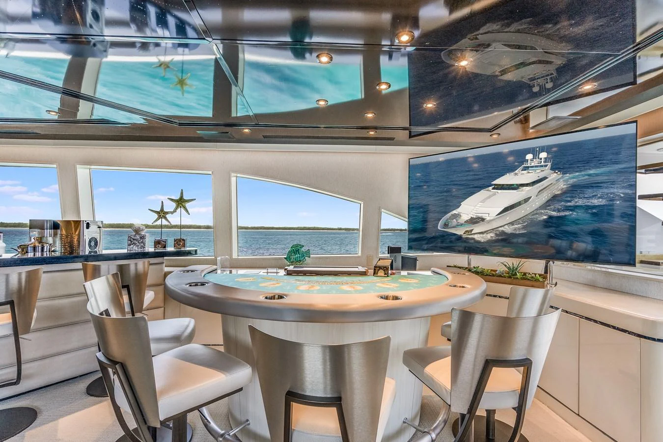 a room with tables and chairs aboard CUPCAKE Yacht for Sale
