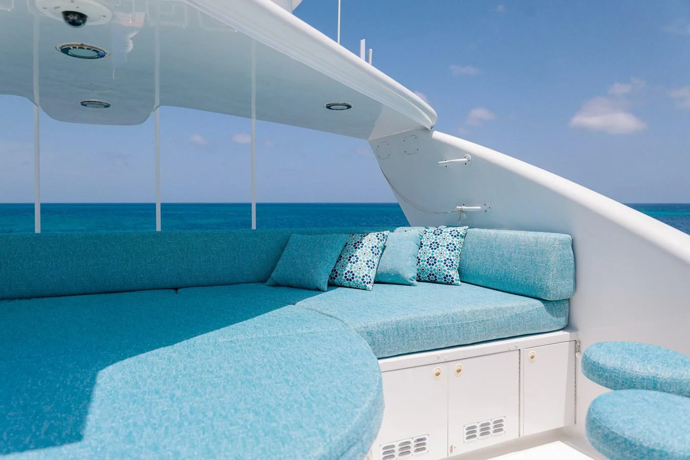 a white boat with blue pillows aboard CUPCAKE Yacht for Sale
