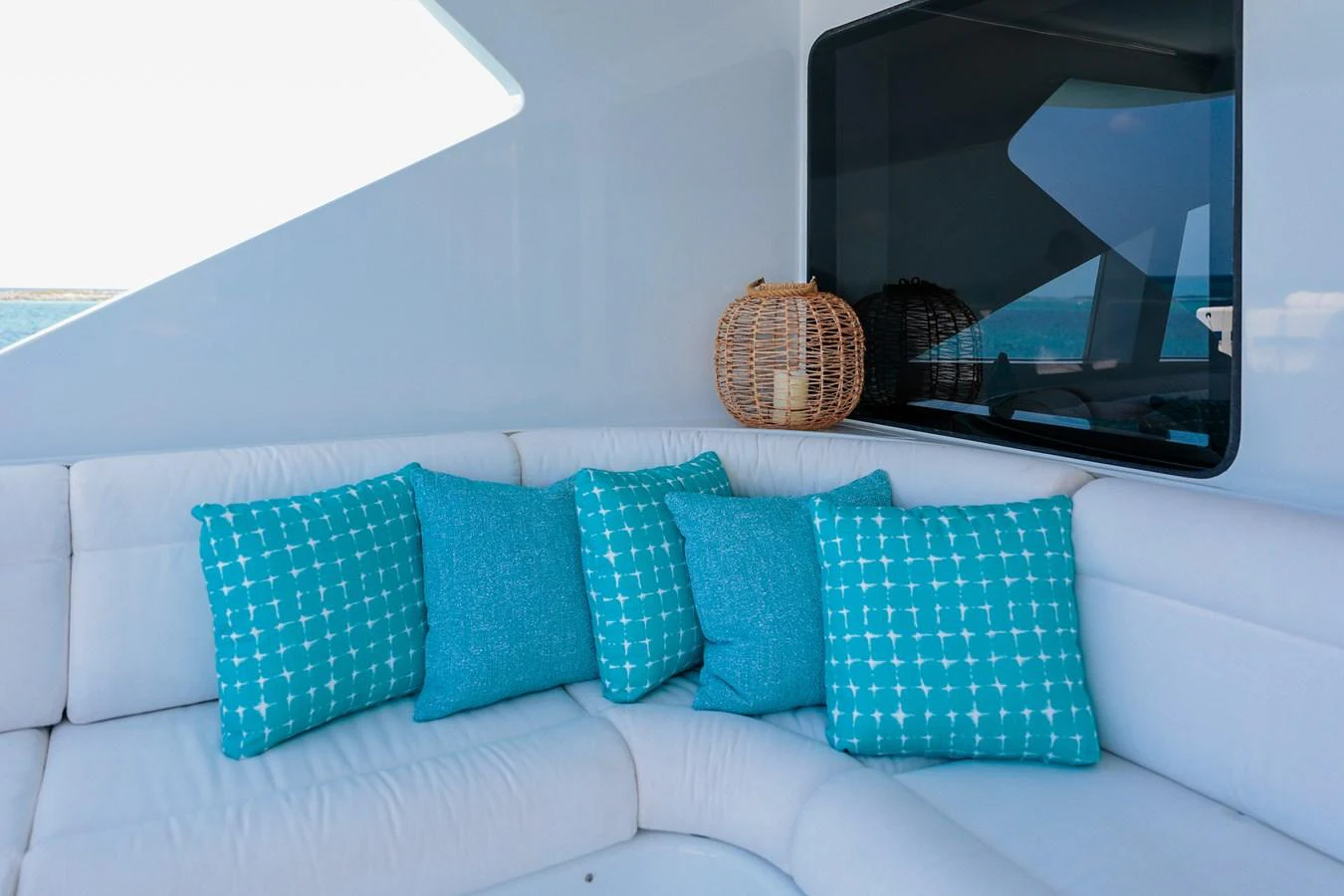 a couch with pillows on it aboard CUPCAKE Yacht for Sale