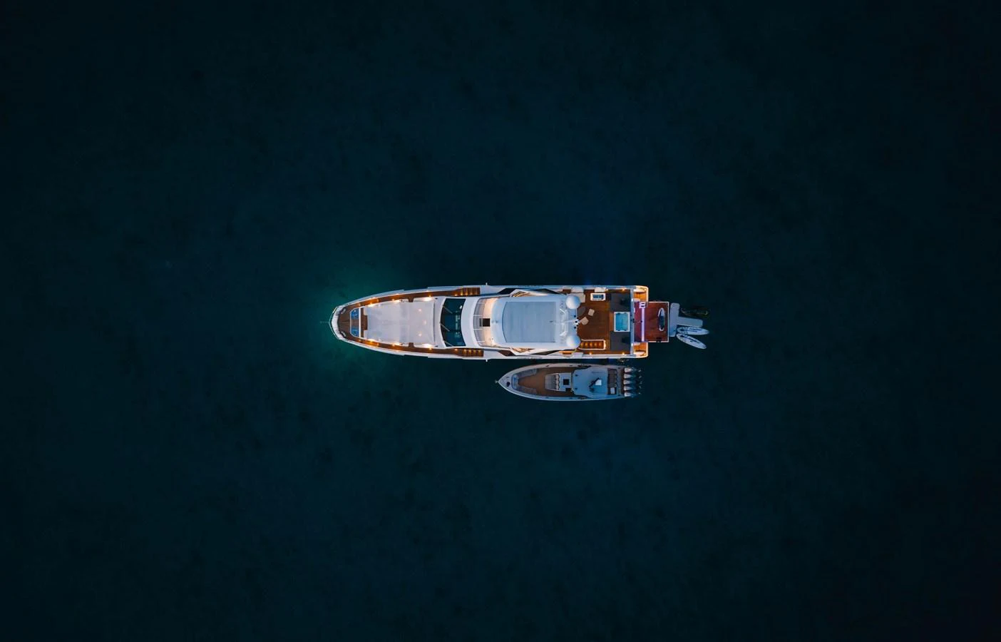 a small boat in the water aboard CARPE DIEM Yacht for Sale