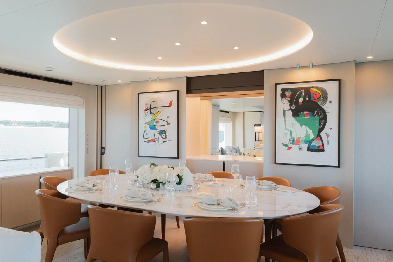 a dining room with a table set aboard CARPE DIEM Yacht for Sale