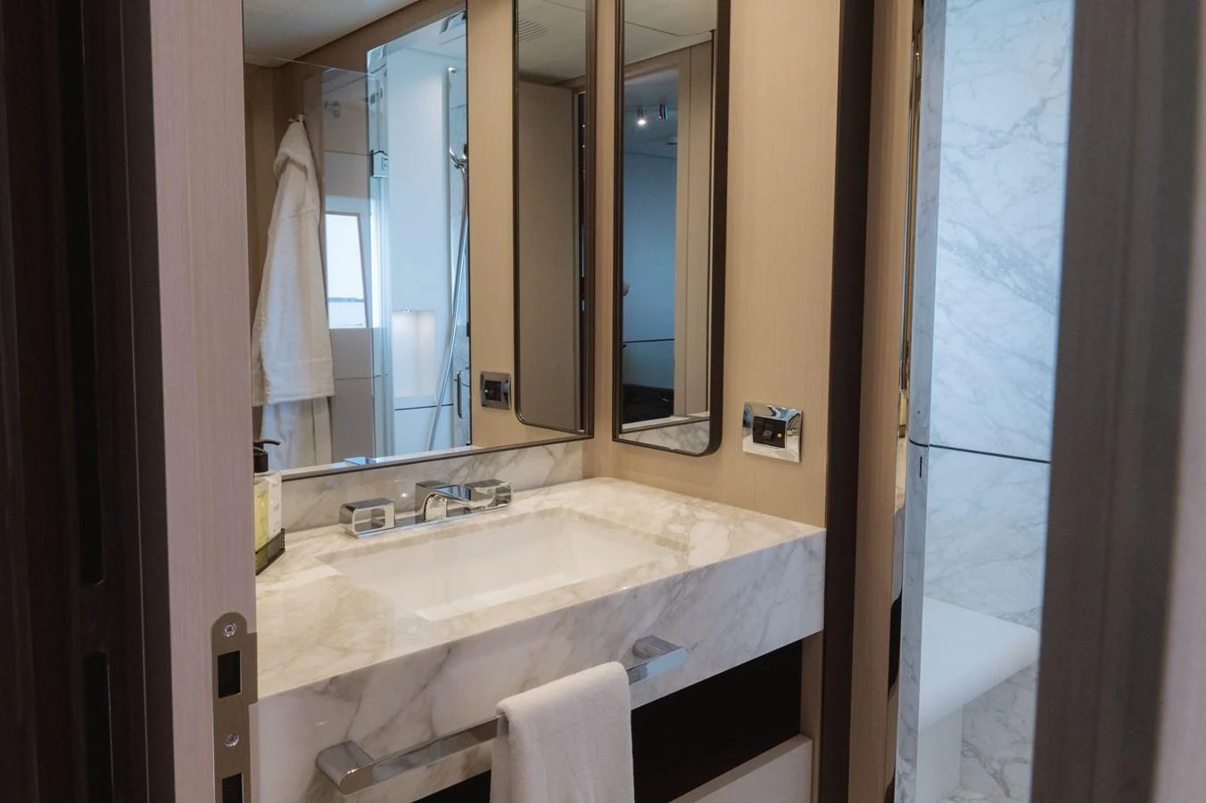 a bathroom with a sink and a mirror aboard CARPE DIEM Yacht for Sale