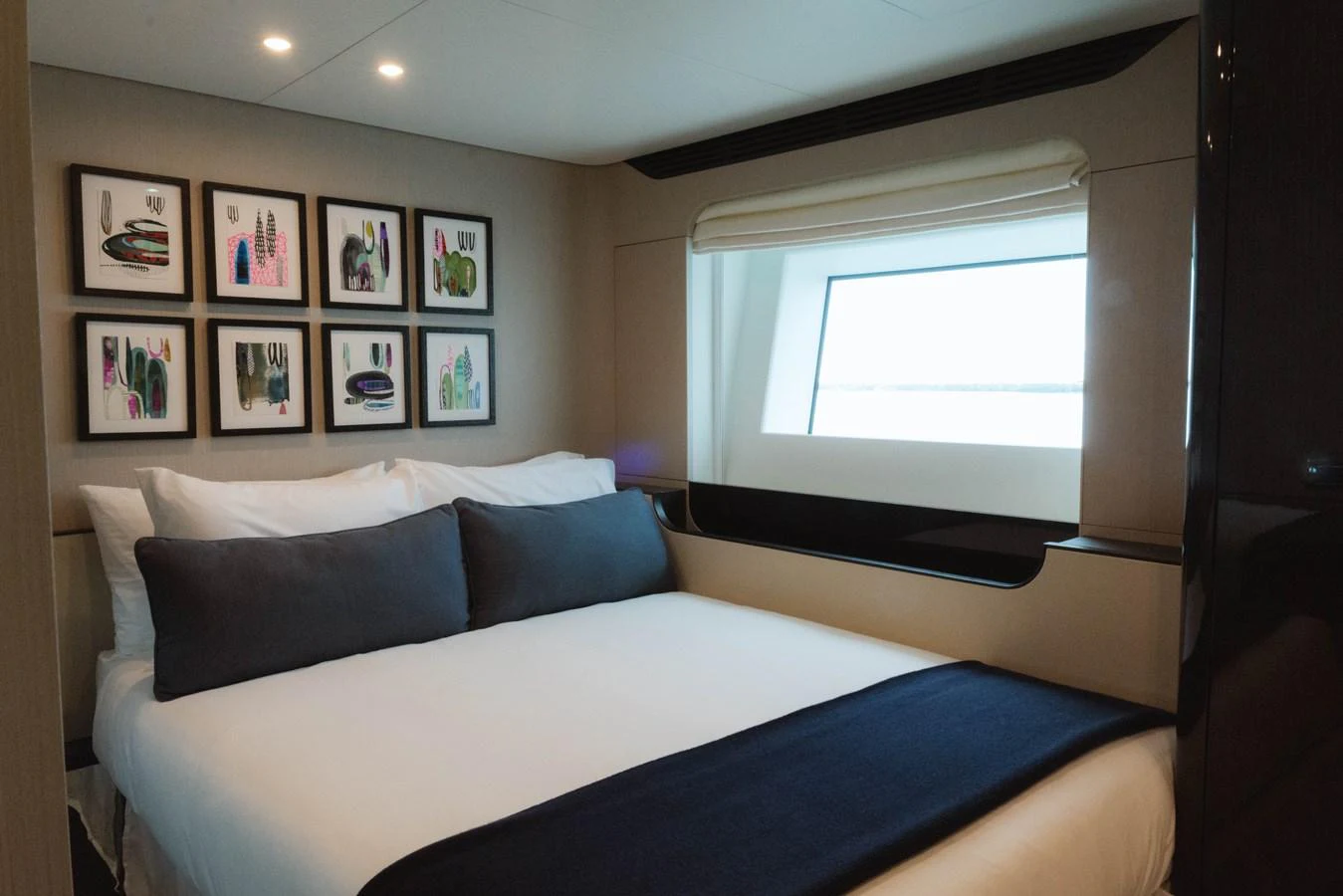 a bed with a blue sheet aboard CARPE DIEM Yacht for Sale