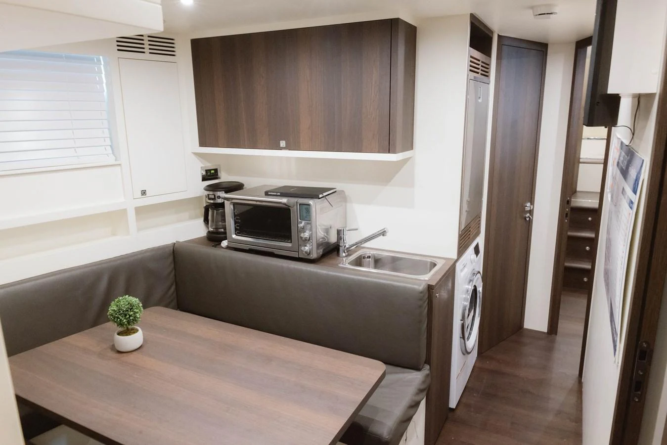 a kitchen with a microwave oven aboard CARPE DIEM Yacht for Sale