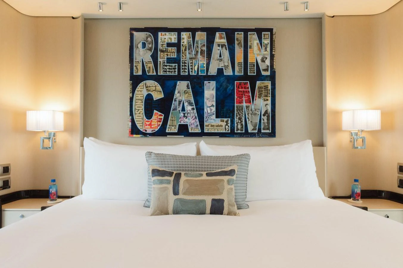 a bed with a poster on the wall aboard CARPE DIEM Yacht for Sale