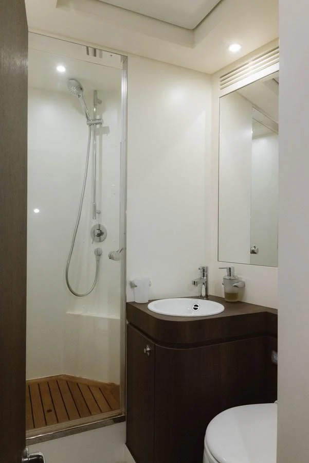 a bathroom with a shower and sink aboard CARPE DIEM Yacht for Sale