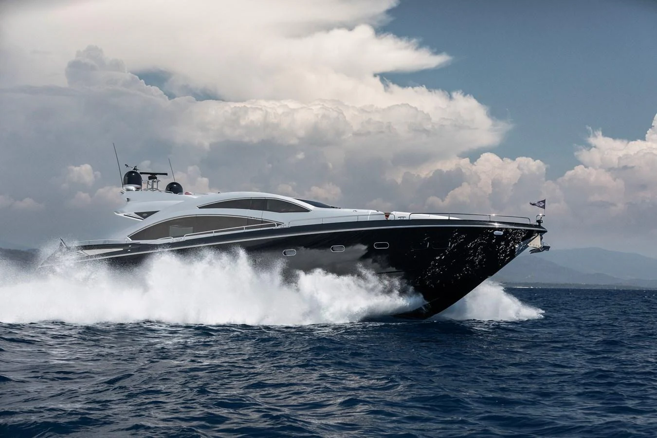 A sleek and powerful yacht cruises swiftly through the open sea, cutting through the waves with ease. aboard AMARA Yacht for Sale