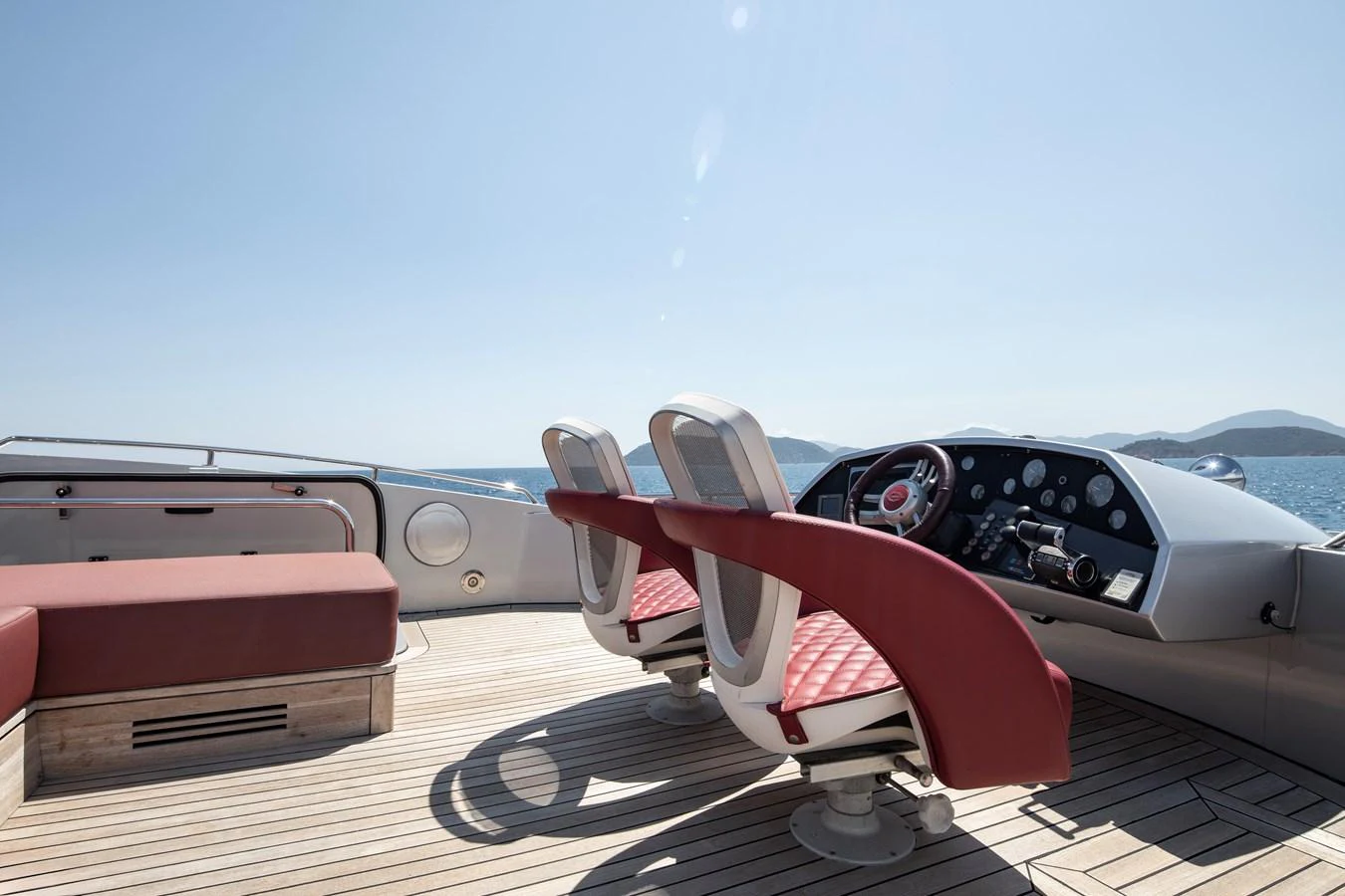 The yacht's helm features sleek, modern seating with a panoramic view of the open sea. aboard AMARA Yacht for Sale