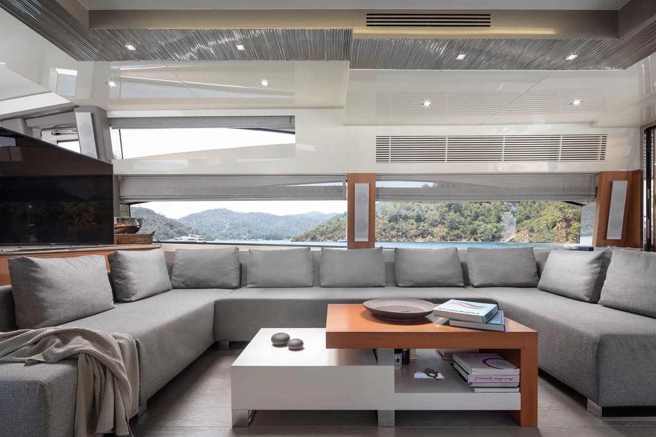 The salon features a spacious and modern seating area with panoramic views. aboard AMARA Yacht for Sale