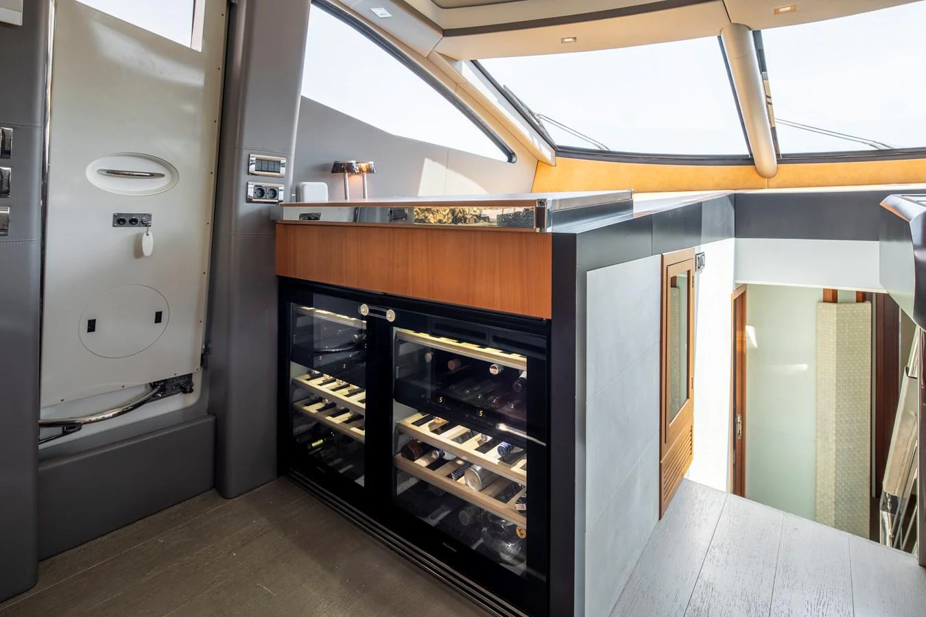 The yacht's galley features modern appliances and ample natural light from large windows. aboard AMARA Yacht for Sale