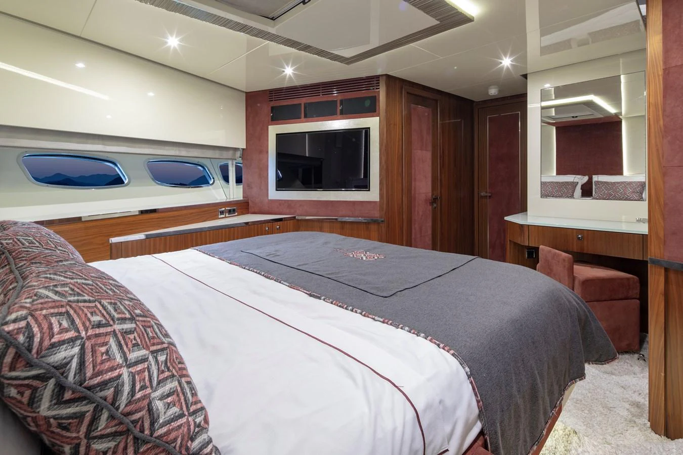The master stateroom features a luxurious bed, ample storage, and elegant decor. aboard AMARA Yacht for Sale