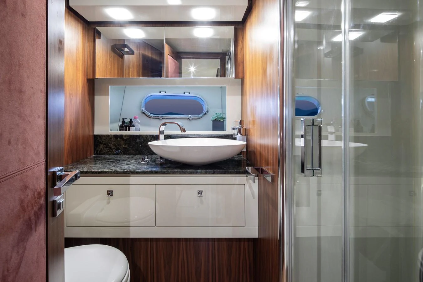 The yacht's bathroom features a sleek design with modern fixtures and a stylish sink. aboard AMARA Yacht for Sale