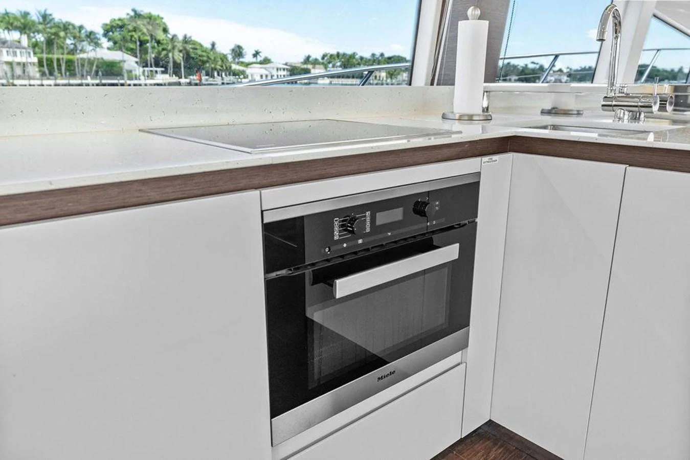 a kitchen with a stove and a window aboard ELEVATION Yacht for Sale
