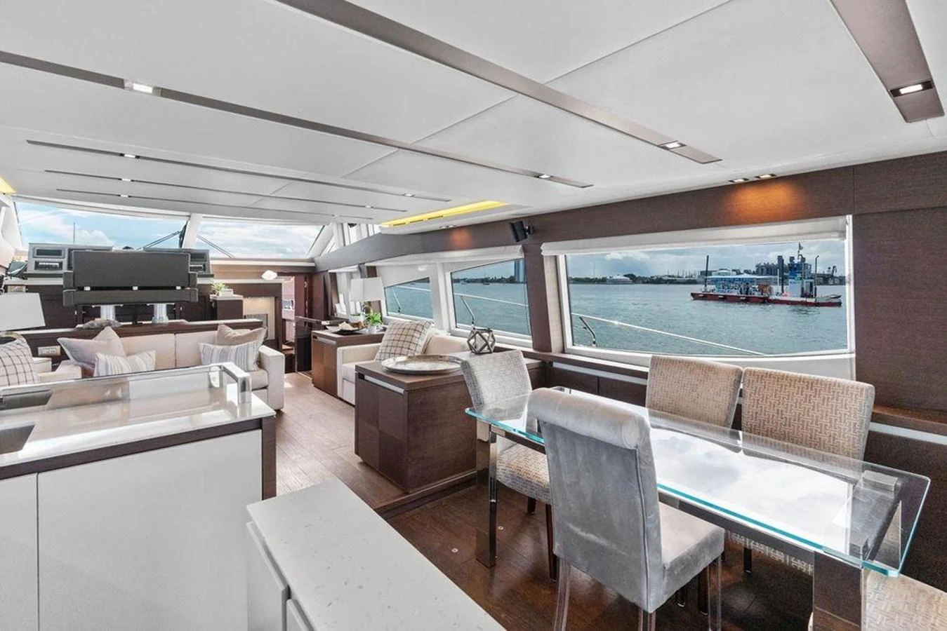 a room with a table chairs and a large pool aboard ELEVATION Yacht for Sale