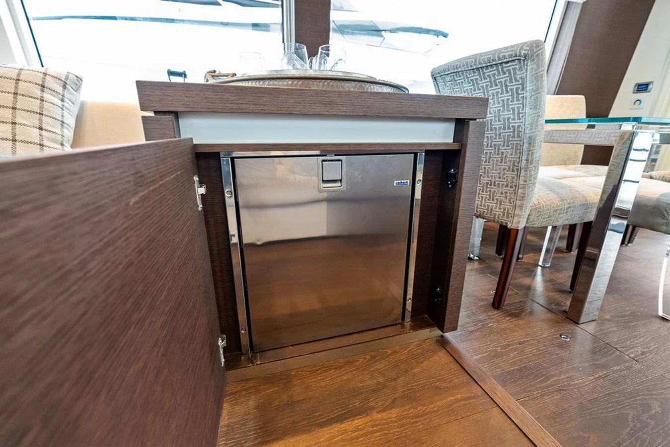 a table with a chair and a bench aboard ELEVATION Yacht for Sale