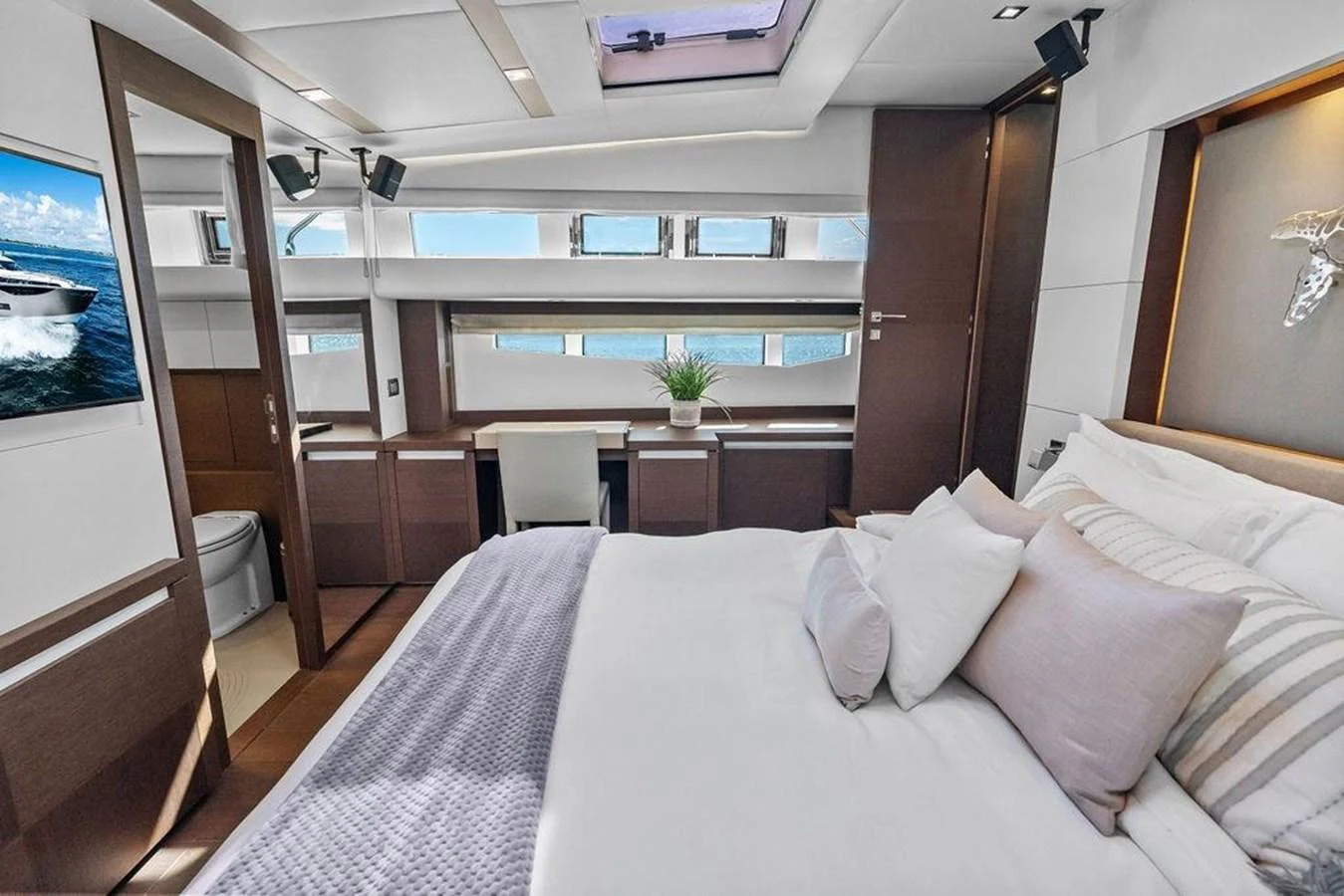 a bed with white sheets aboard ELEVATION Yacht for Sale