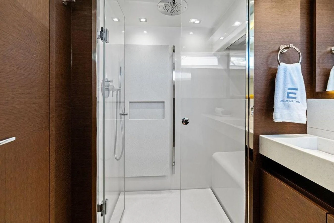 a bathroom with a glass shower aboard ELEVATION Yacht for Sale
