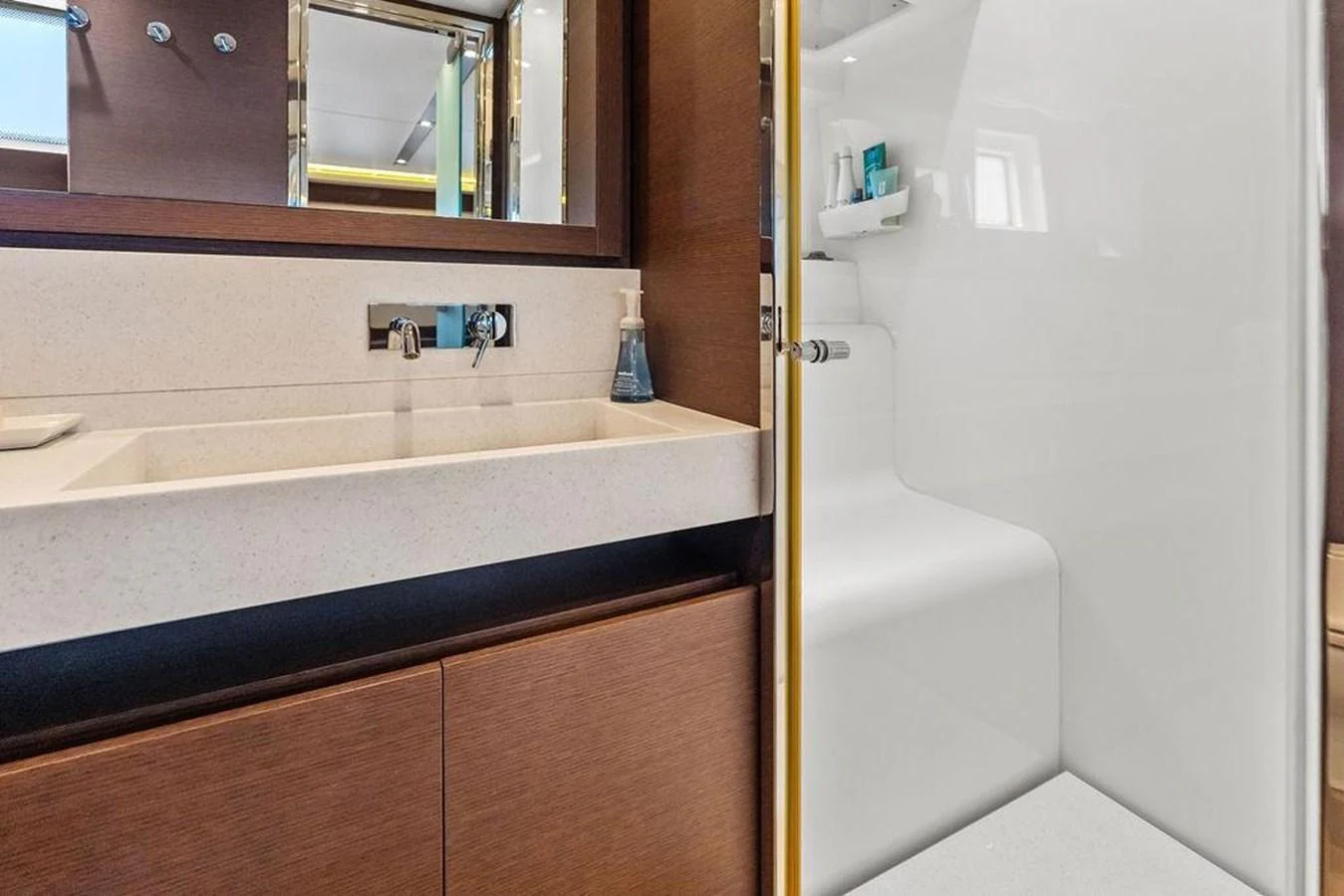 a bathroom with a sink and a mirror aboard ELEVATION Yacht for Sale