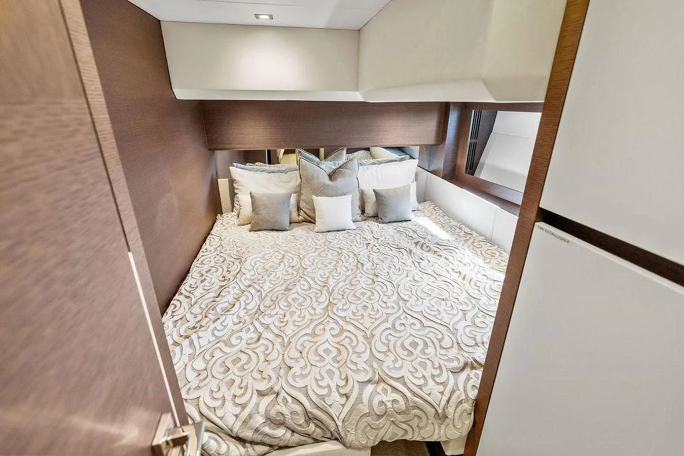 a bed with white sheets aboard ELEVATION Yacht for Sale