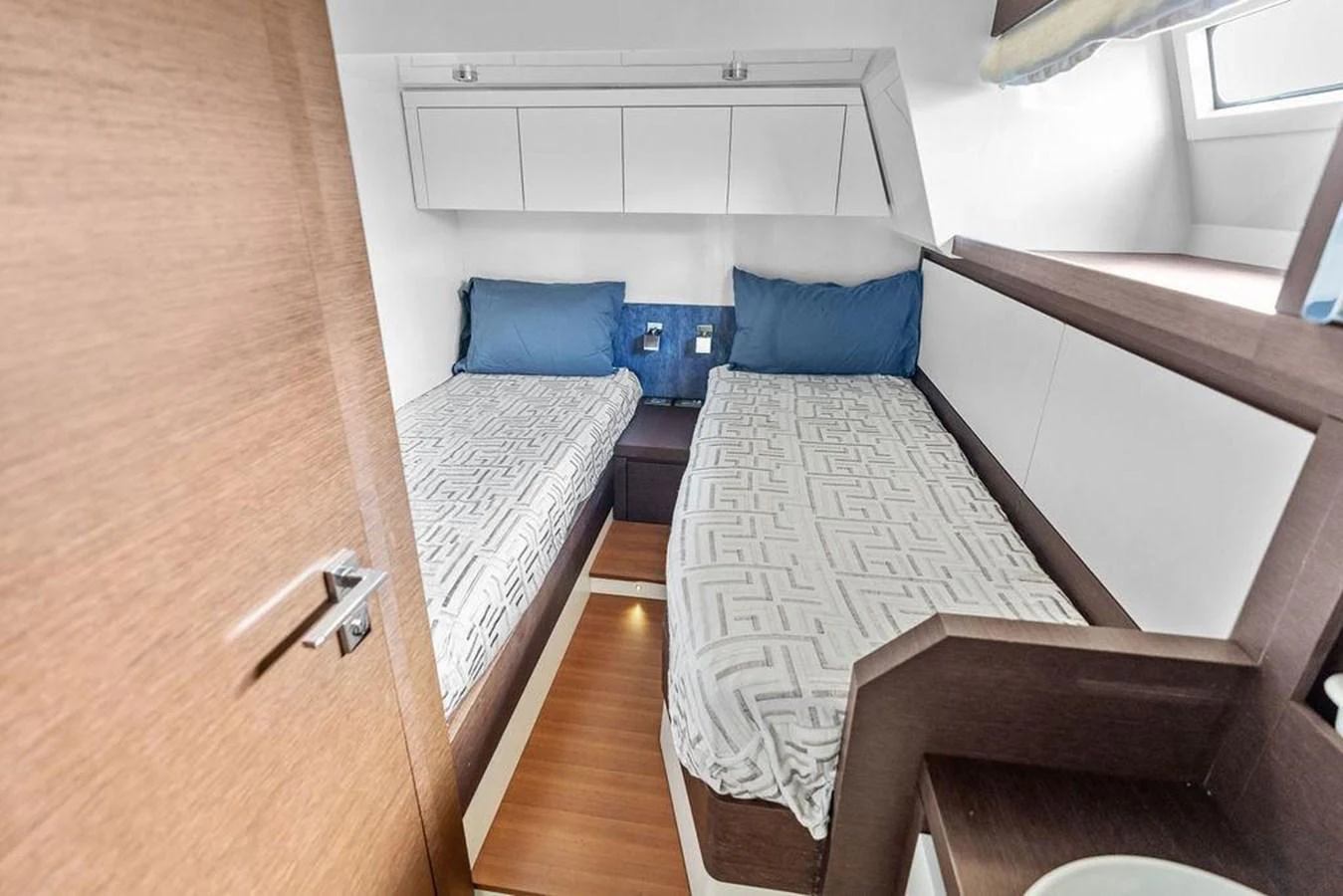 a couple of beds in a room aboard ELEVATION Yacht for Sale