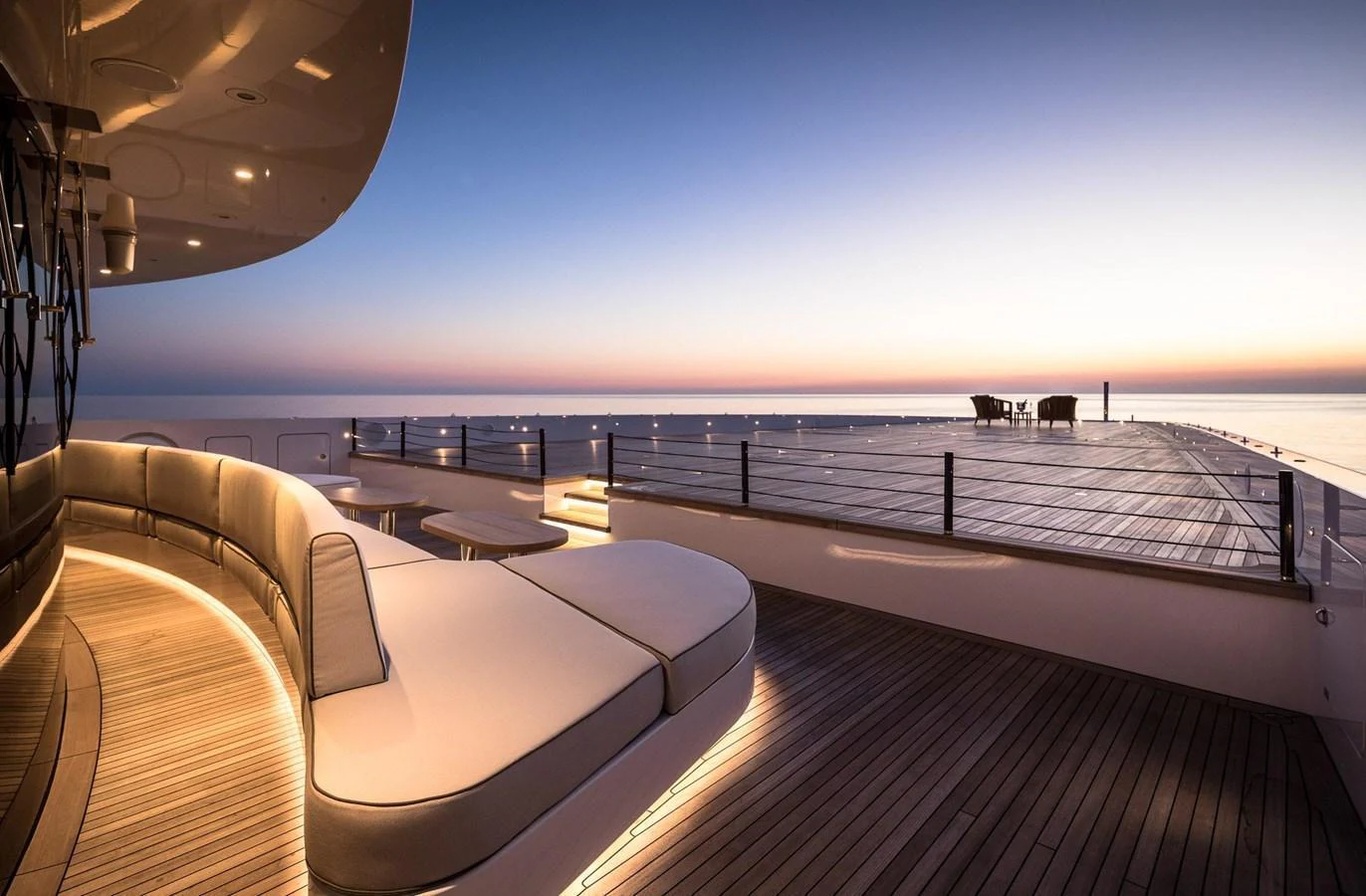 The aft deck offers a serene and spacious area for relaxation with stunning sunset views over the water. aboard LANA Yacht for Sale