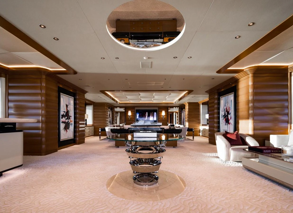 The luxurious salon features elegant furnishings and ample space for relaxation and entertainment. aboard LANA Yacht for Sale