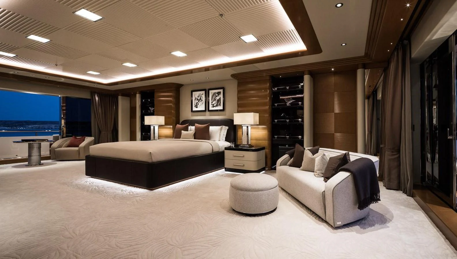 The master stateroom exudes luxury with its spacious layout, elegant furnishings, and panoramic views. aboard LANA Yacht for Sale