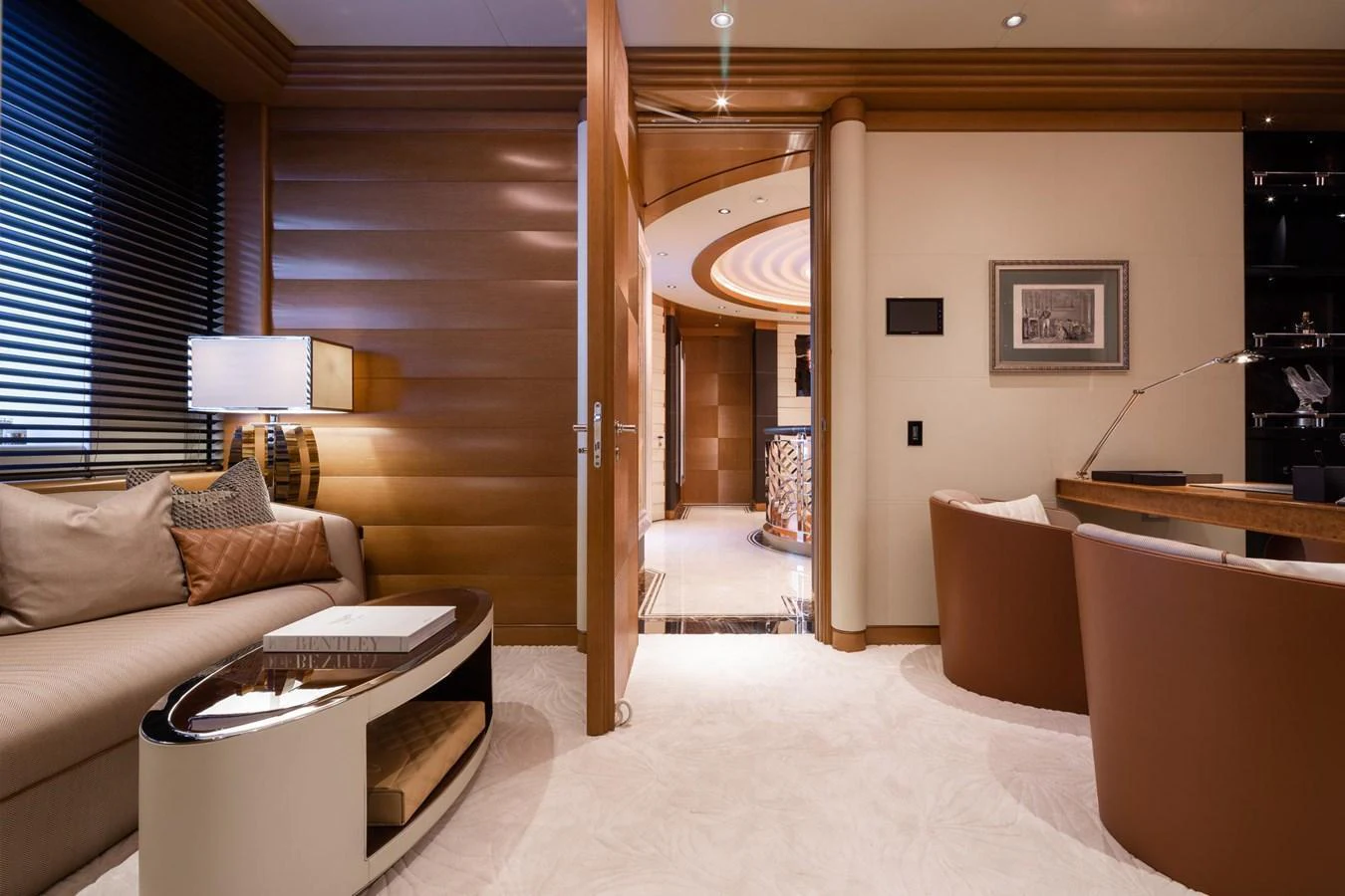 The yacht's interior features a luxurious seating area with elegant furnishings and warm lighting. aboard LANA Yacht for Sale