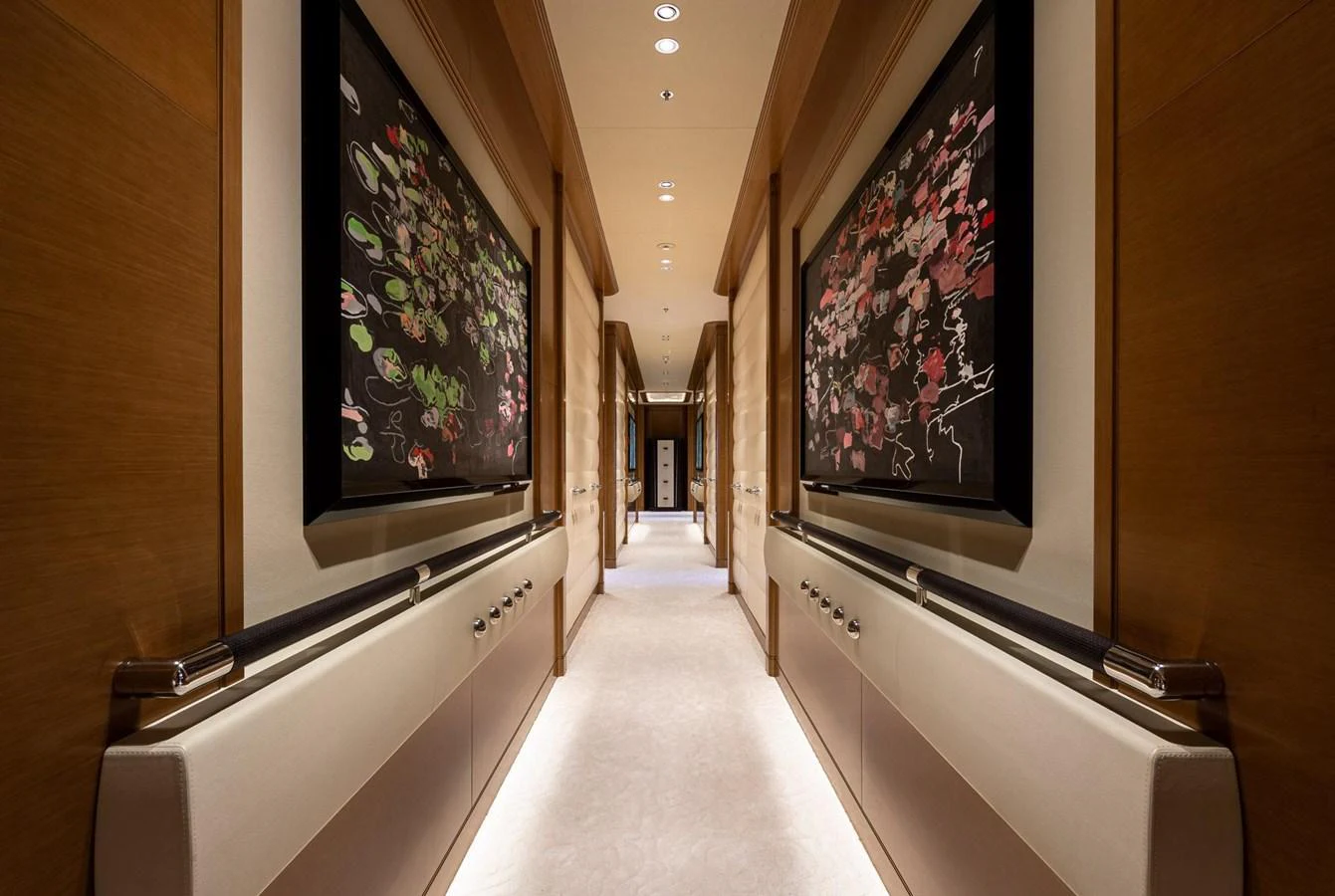 A luxurious hallway adorned with elegant artwork and soft lighting. aboard LANA Yacht for Sale