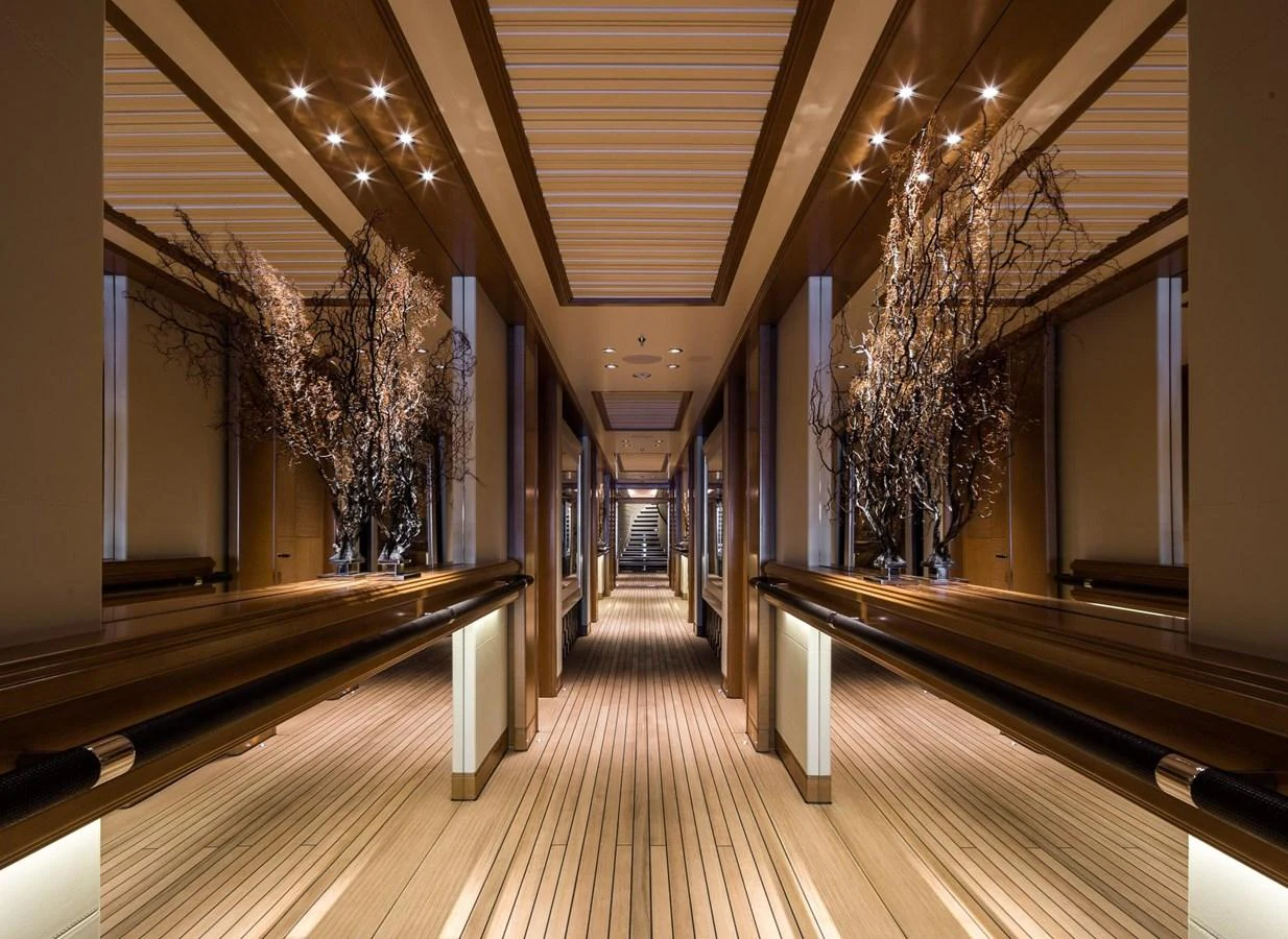 A luxurious hallway with elegant lighting and sophisticated decor. aboard LANA Yacht for Sale