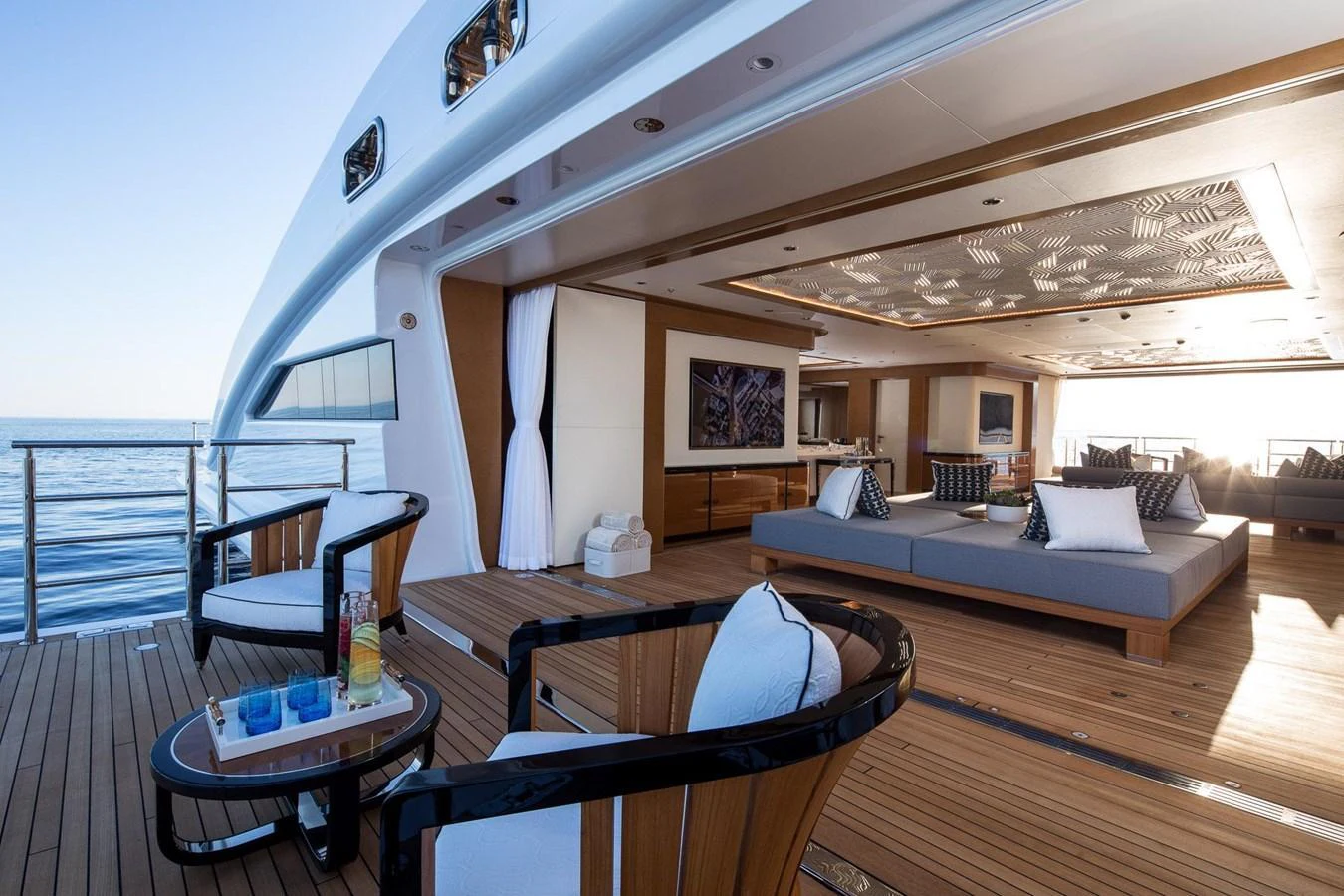 The aft deck offers a luxurious lounging area with comfortable seating and stunning ocean views. aboard LANA Yacht for Sale
