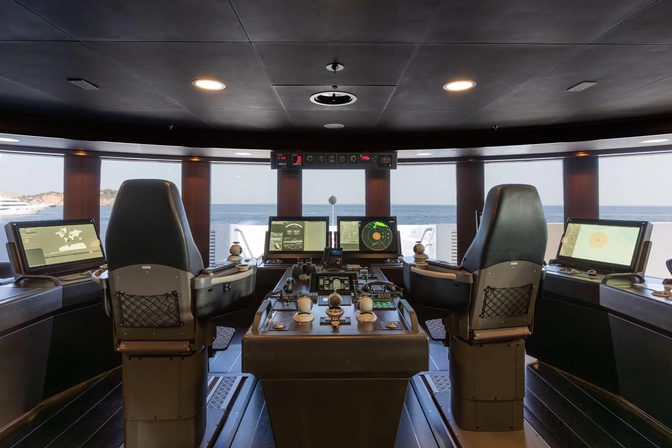 The helm station offers a commanding view with state-of-the-art navigation equipment. aboard I DYNASTY Yacht for Sale