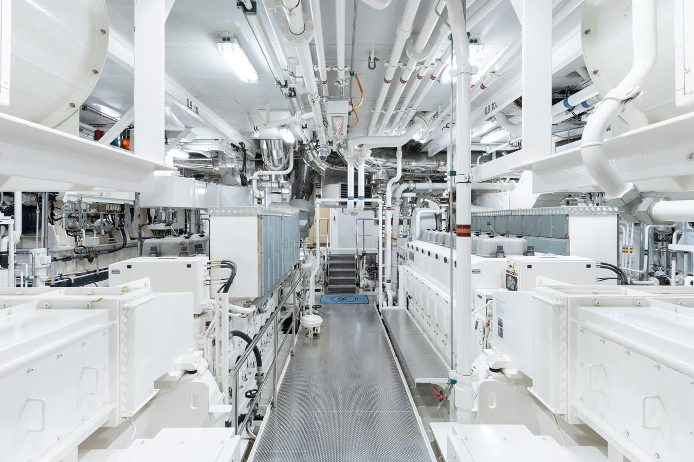 The engine room showcases a meticulously organized and well-maintained space with advanced machinery and piping. aboard I DYNASTY Yacht for Sale