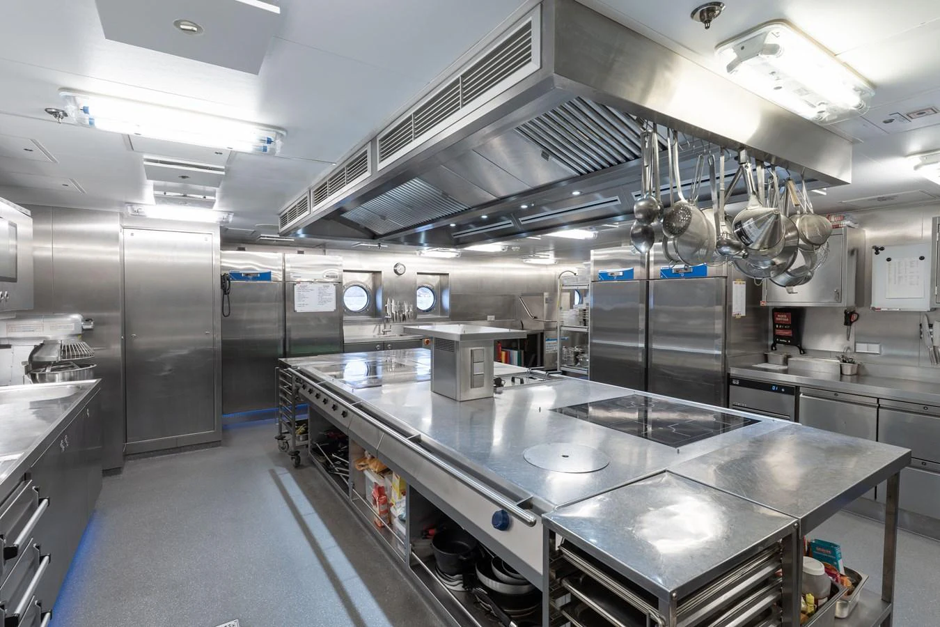 The yacht's galley is equipped with professional-grade stainless steel appliances and ample workspace. aboard I DYNASTY Yacht for Sale