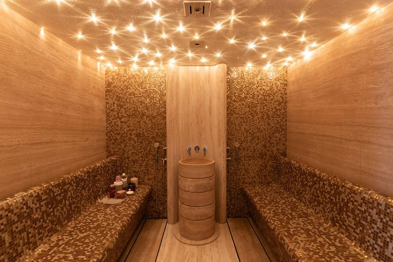 The yacht features a luxurious spa with ambient lighting and elegant decor. aboard I DYNASTY Yacht for Sale