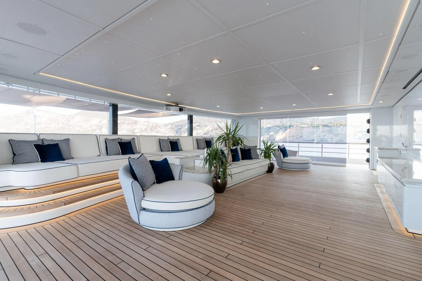 The spacious salon features elegant seating and modern decor with ample natural light. aboard I DYNASTY Yacht for Sale