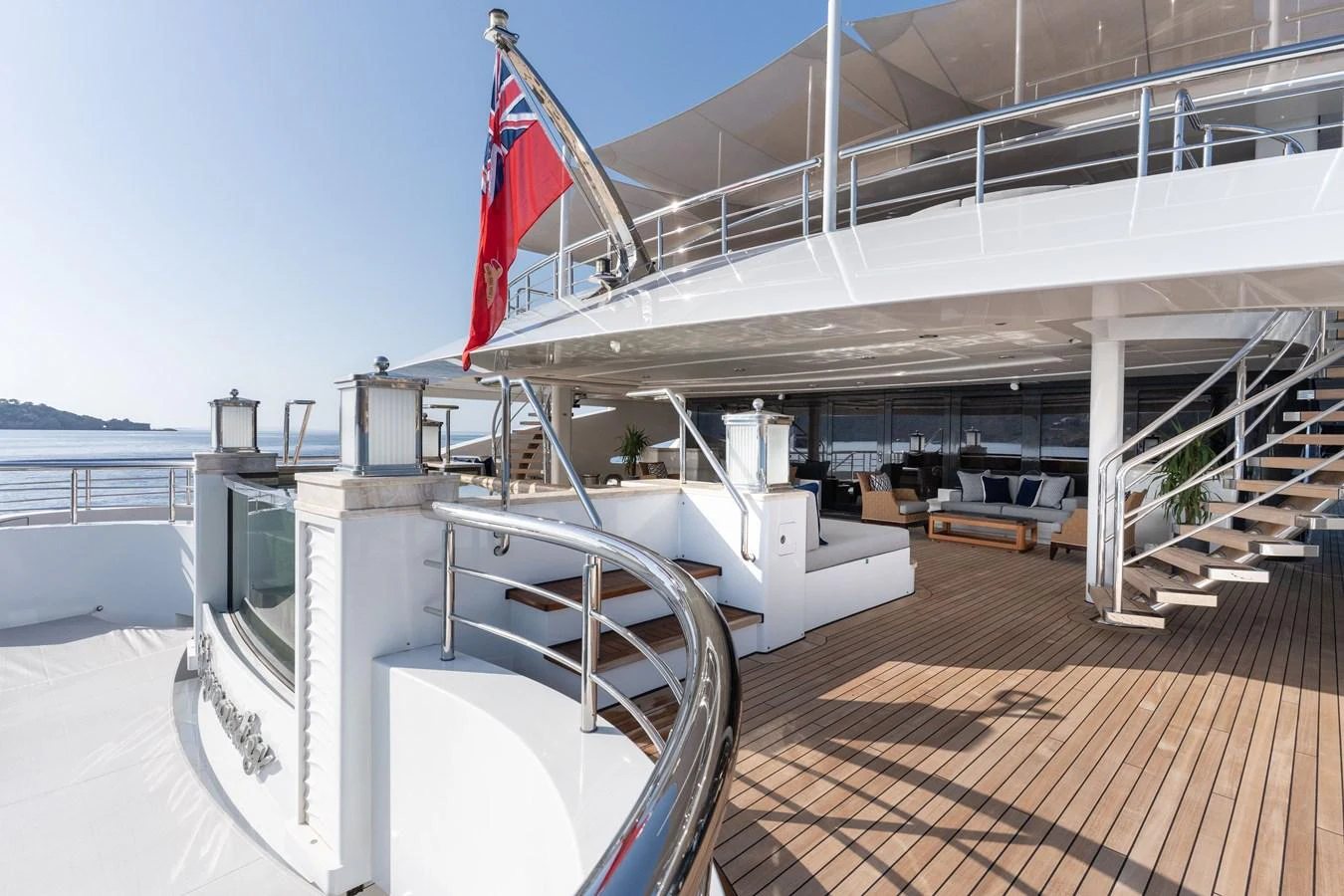 The spacious aft deck offers a luxurious outdoor living area with ample seating and elegant design. aboard I DYNASTY Yacht for Sale