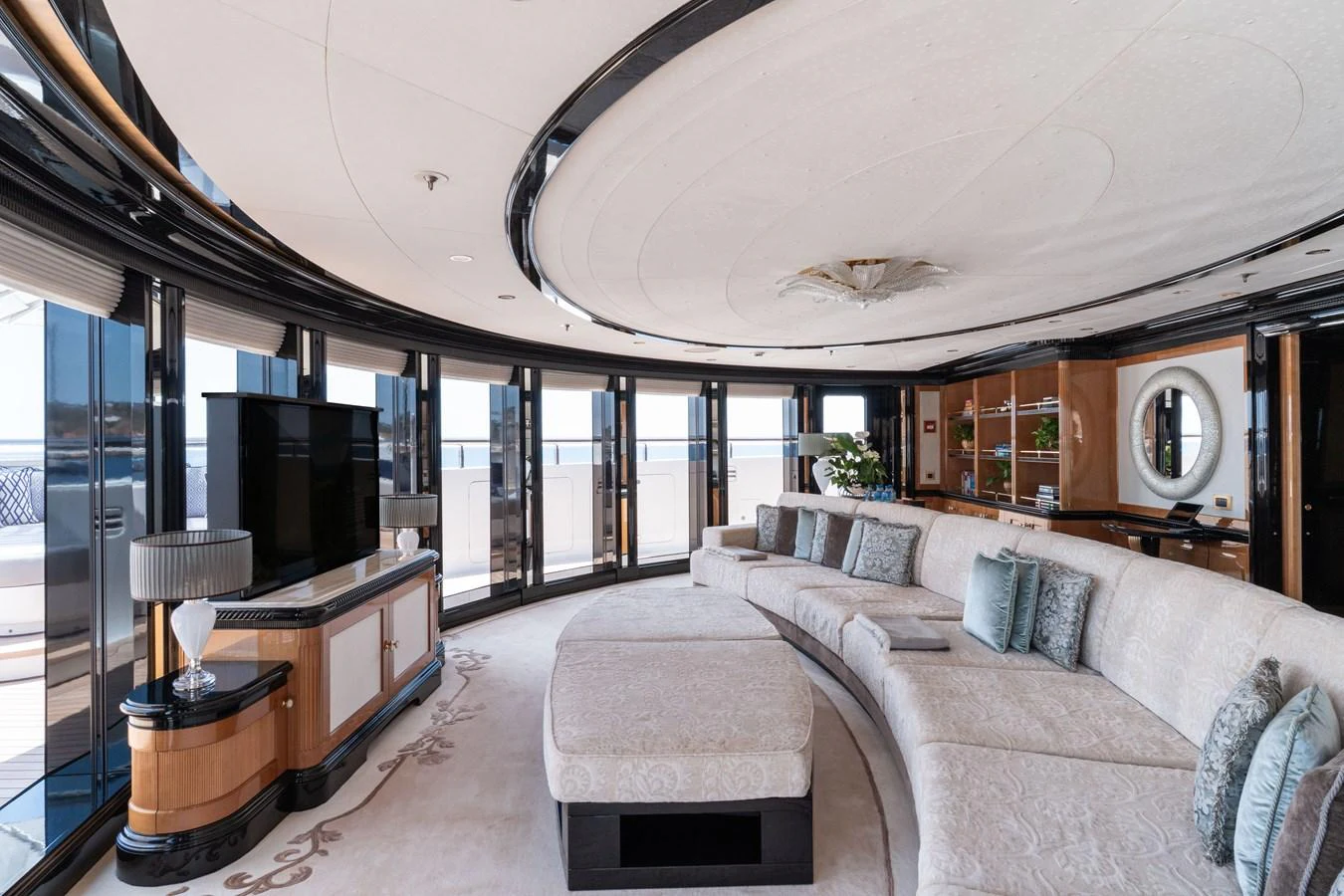 The spacious salon features elegant furnishings and panoramic windows for a luxurious and comfortable experience. aboard I DYNASTY Yacht for Sale
