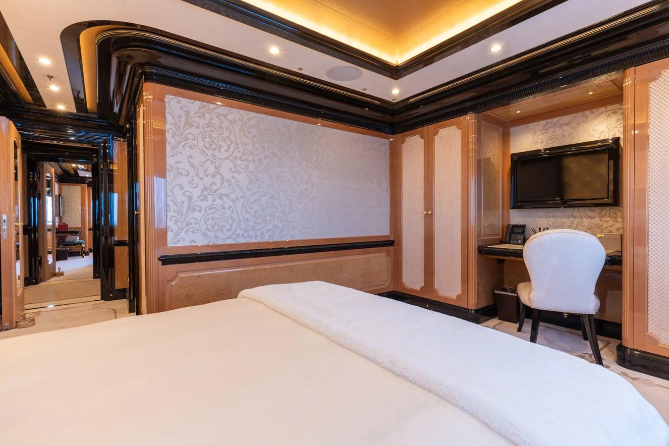 The master stateroom features elegant decor with luxurious bedding and a spacious layout. aboard I DYNASTY Yacht for Sale