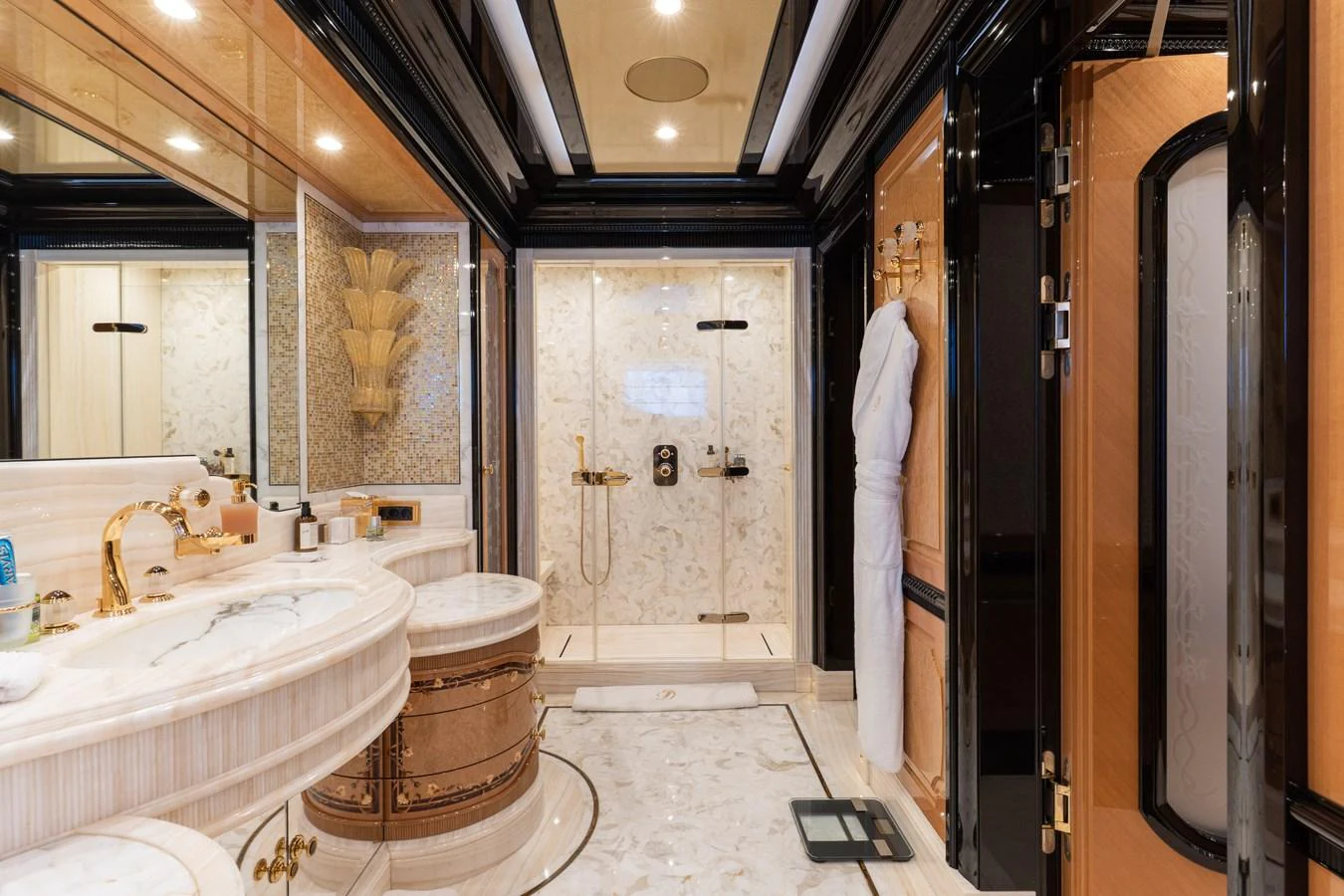 The luxurious bathroom features elegant fixtures and a spacious shower area. aboard I DYNASTY Yacht for Sale